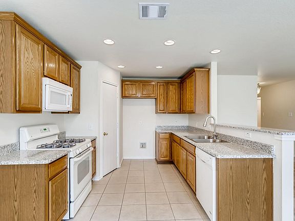 Plenty of room for cooks and large pantry. Buffet ledge for entertaining