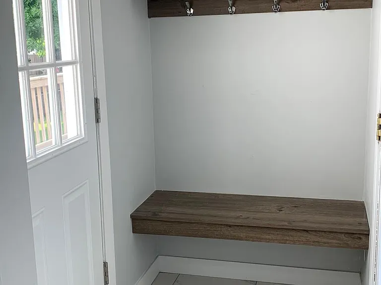 Entry from garage and to outdoor wood deck area