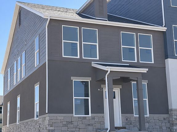 Oxley Floor Plan Exterior with Covered Porch - Beacon Pointe Townhomes Saratoga Springs Utah