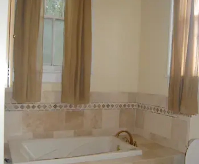 Upstairs bathroom, includes jacuzzi, large shower, toilet, double sink