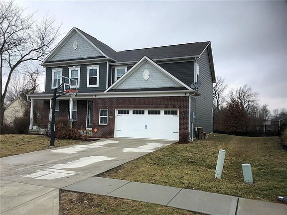 Two car attached garage with bump out with extra space for storage!