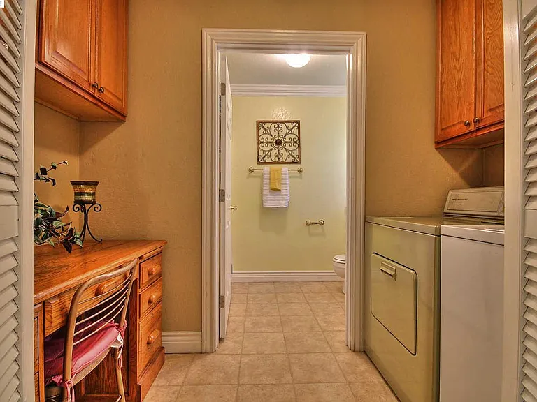 Laundry and Bathroom with a nice work area. Perfect for Working from home.