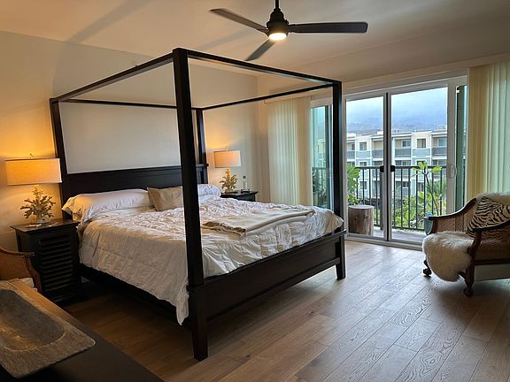 Master bedroom with balcony view of Pali