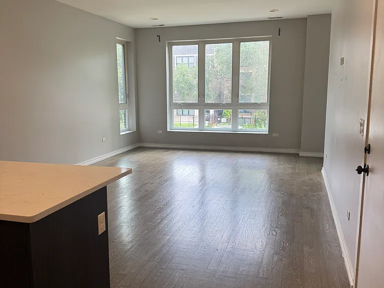 Large open living space with small side area for office
