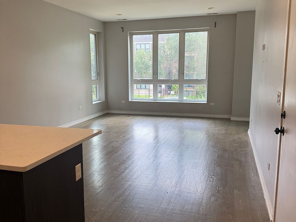 Large open living space with small side area for office