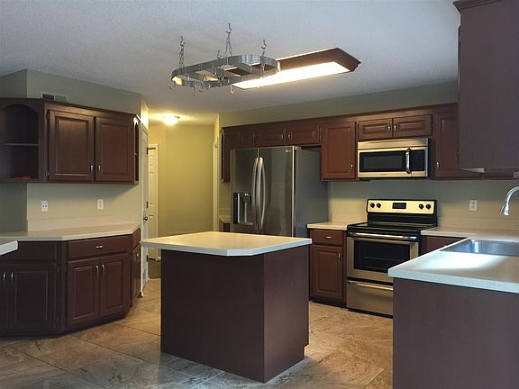 Spacious kitchen with built in desk area