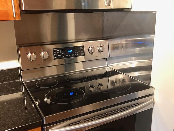Kitchen: newer range and microwave.