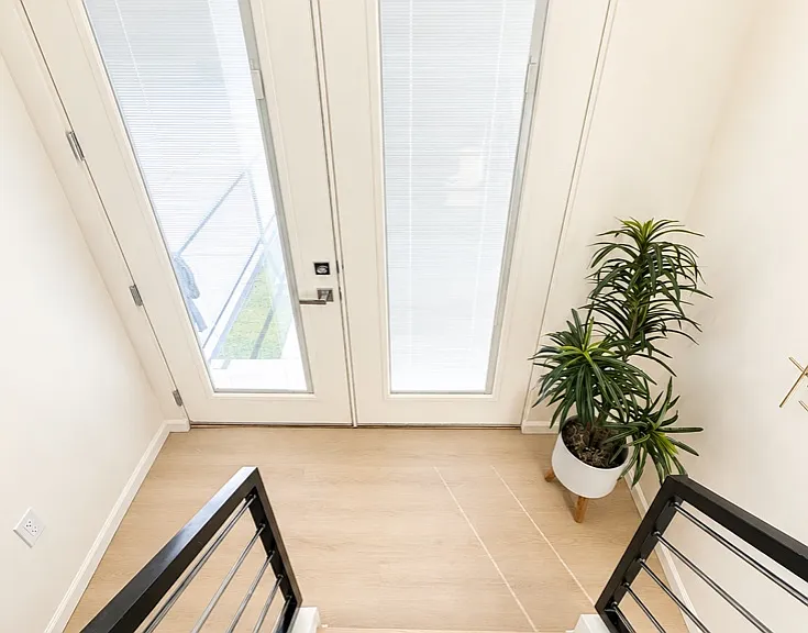 Front doors as viewed from inside the home.