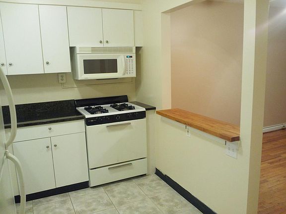 Kitchen/Gas stove and microwave/open window