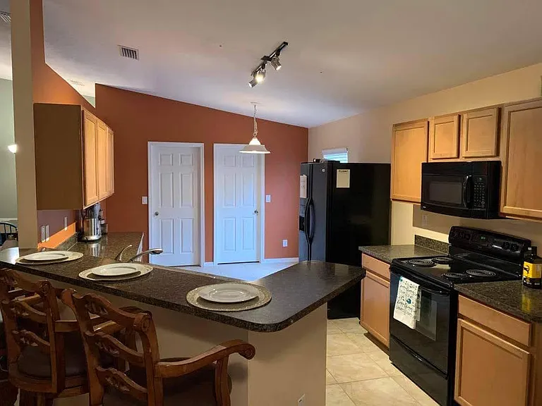 large kitchen with walk in pantry access to laundry and thru to two car garage