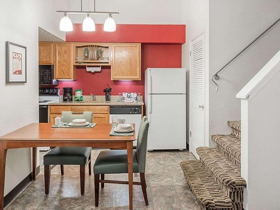 This is the other part of the first floor at the Penthouse. You will have: A dining table with chairs, a Full Kitchen with