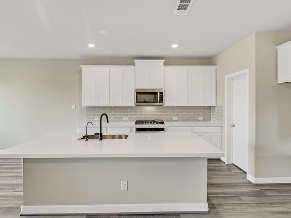 Kitchen. Note Sample product photo - actual exterior and interior selections may vary by homesite