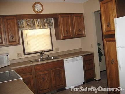 Kitchen With New Flooring, Countertop, & Sink