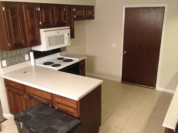 Kitchen with tile floor.