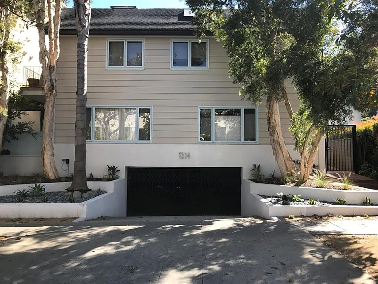 Front of building, garage parking below