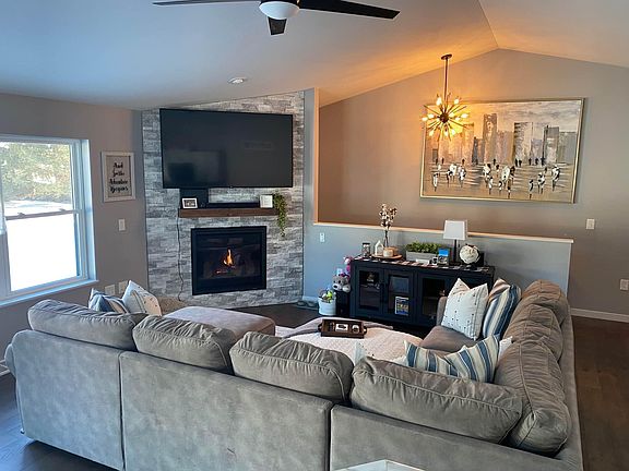 Large, open concept living space with vaulted ceiling