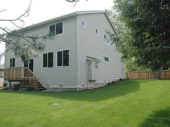 Large sunny backyard is fenced and landscaped. No work here--just move in. Deck off Kitchen.