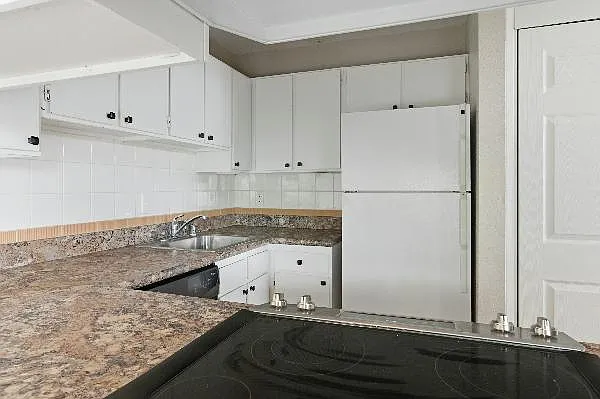 Kitchen with bar open to dining room