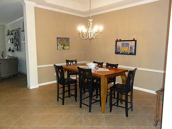 The spacious dining room is easily accessible from the kitchen.