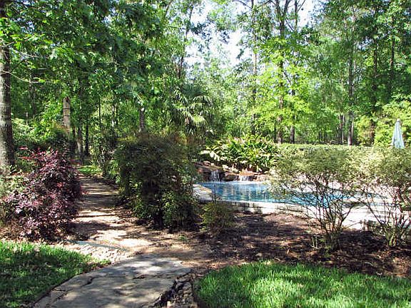 Shady nature trails wander through the backyard.