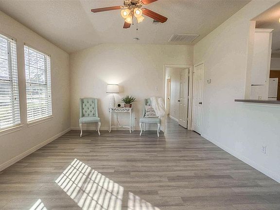 Enter into the living area with impeccable brand new vinyl/wood flooring.