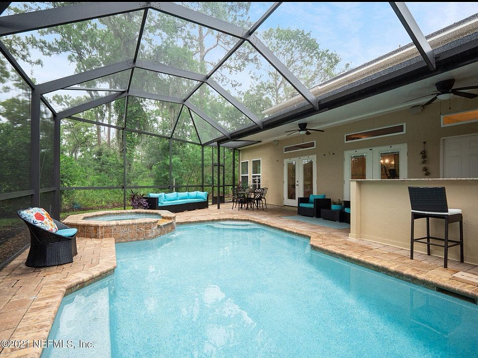 House on cul-de-sac, backs up to undeveloped land. Includes pool, hot tub, and outdoor kitchen!