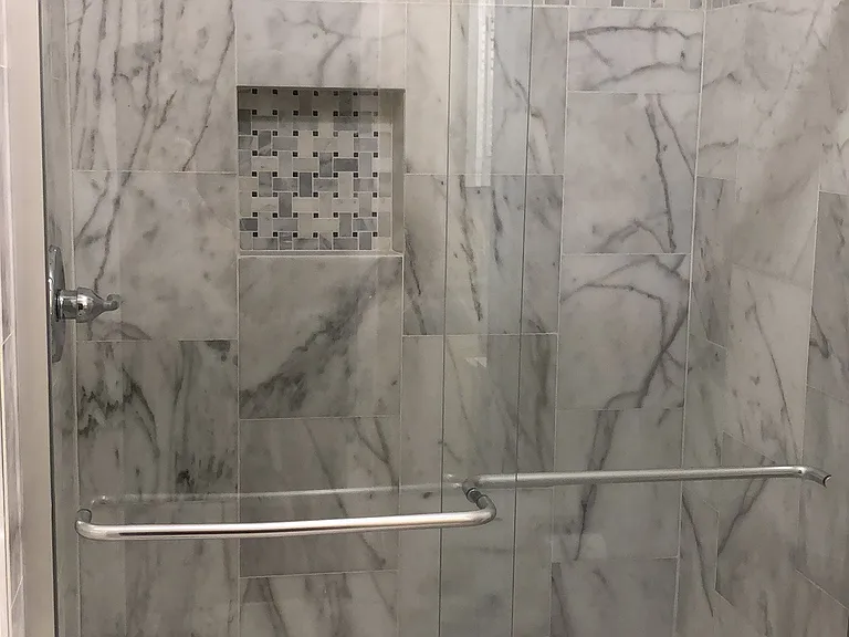Master bathroom with marbled shower