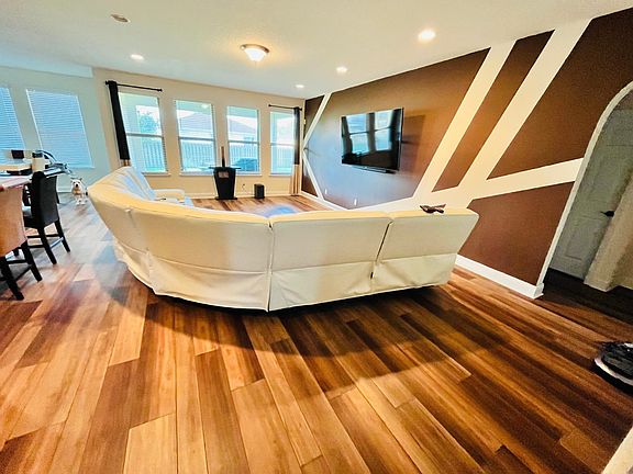 Huge living room, 4 large windows for natural lighting. To the right is the guest area & laundry room, to the left is full kitchen & breakfast nook