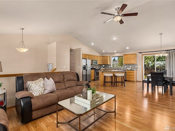 Open concept with vaulted ceilings and defined spaces.