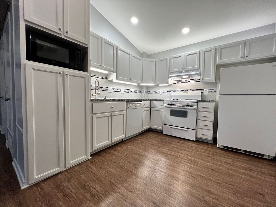 Updated kitchen includes appliances.