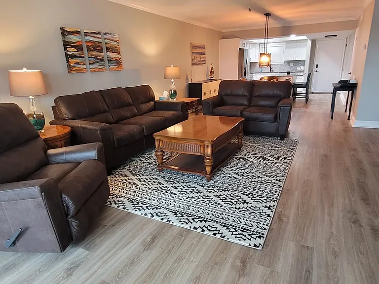 Great room with brand new sofa, love seat and matching recliner. Includes 65" TV with full cable and internet connection