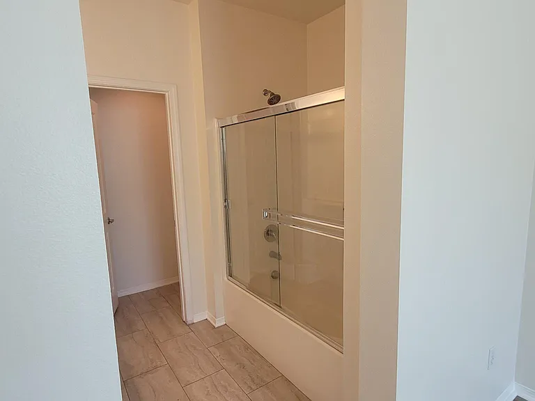 Large primary - en-suite shower/bath.