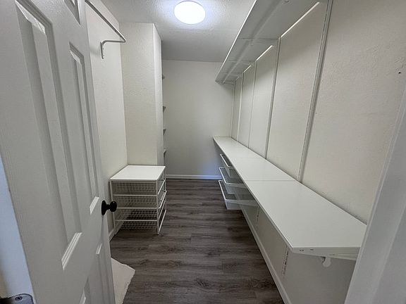 the walking closet of the first master bedroom
