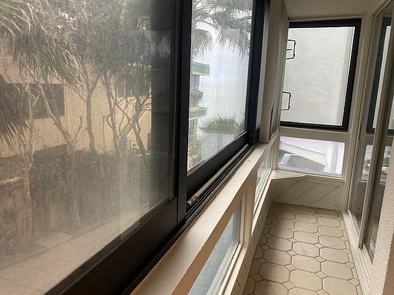 enclosed balcony off the sunroom with ocean view