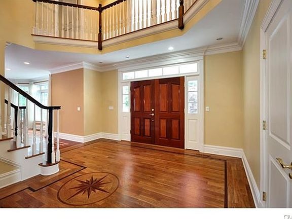 Gracious two story entrance with detailed inlays