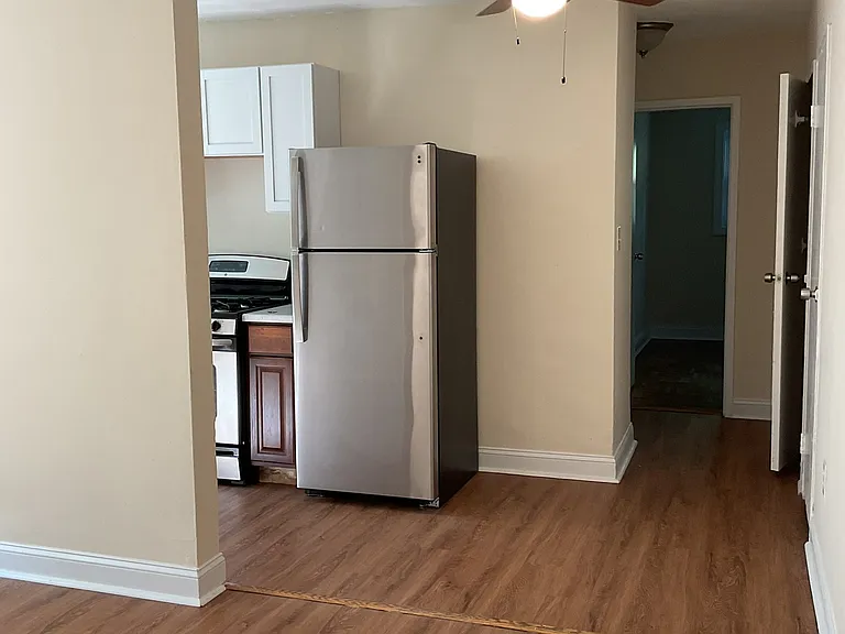 Living room opens to kitchen with table space