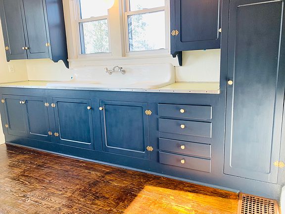 Original, refinished kitchen cabinetry.