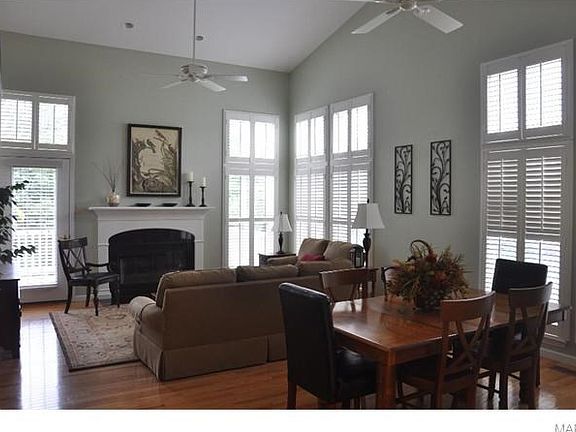 1st View Formal Dining & Great Room with Gas Fireplace & Plantation Shutters