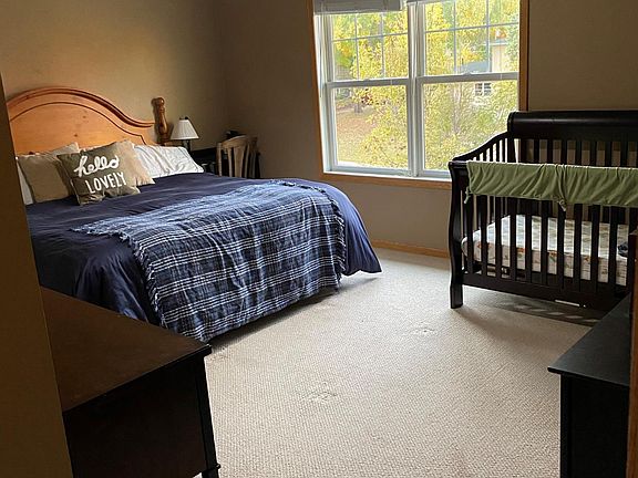 Large master bedroom with beautiful views and a ceiling fan so you're always comfortable.