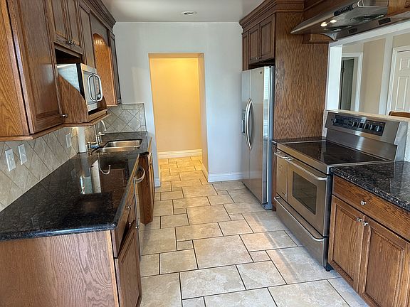 Kitchen, with Stove, Fridge, and Microwave