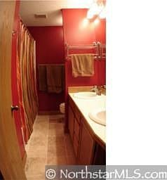master bath with jacuzzi tub, dual sinks, marble floors