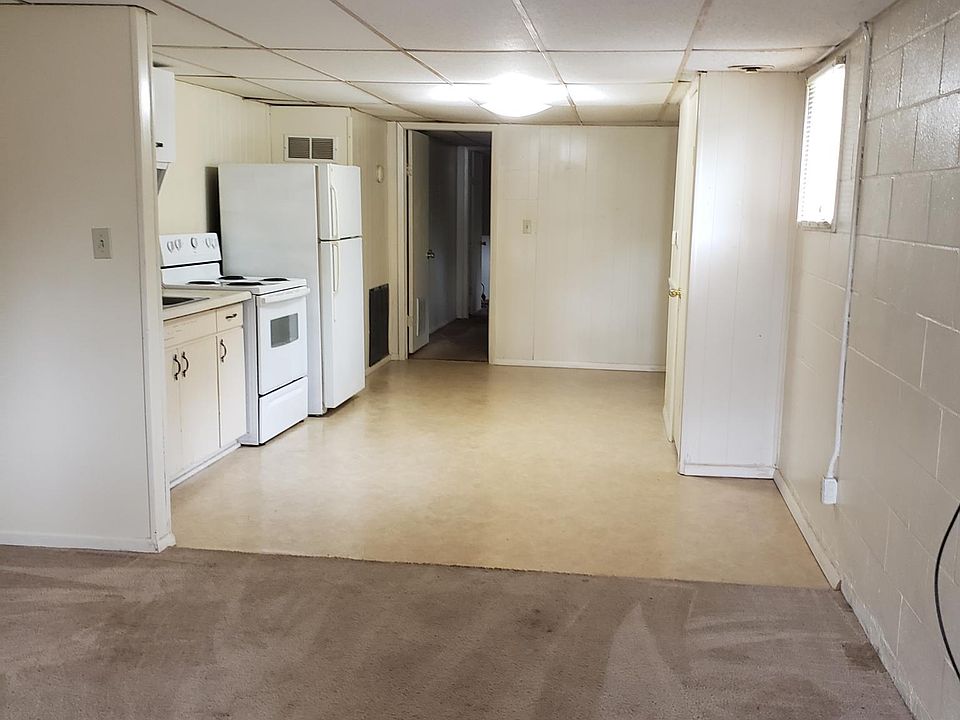 Living room looking into eat in kitchen