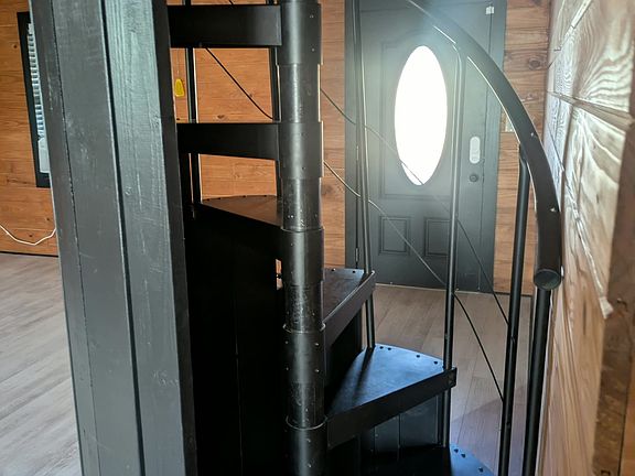 Coming in the front door, you see the spiral staircase leading to the loft.