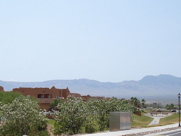 Enchantment Condos in the distance
						:
						From north end of Greens Way, toward 2nd entrance which is nearest the condo.