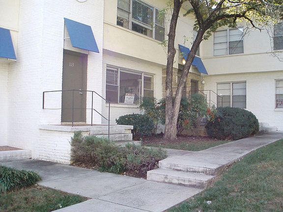 Private entrance opens to large courtyard green space