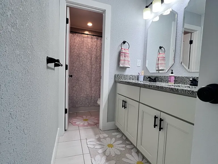 Double sink shared bathroom upstairs