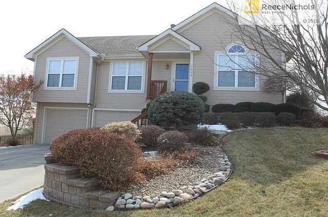 CLAY RIDGE RAISED RANCH WITH AMENITIES GALORE!