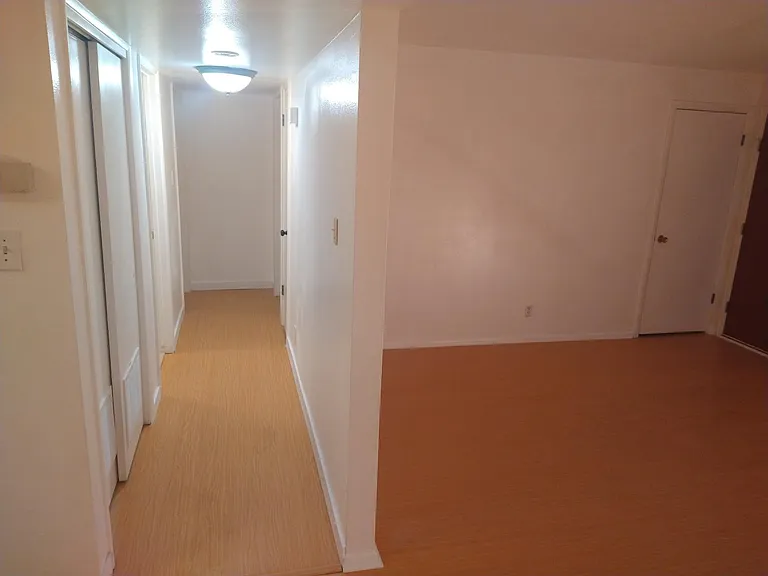 Living room and hall, lots of room, vinyl flooring for easy cleaning.