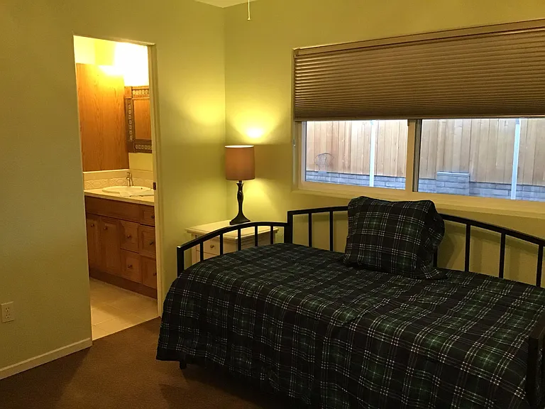 Guest bedroom With twin trundle beds and 3/4 bath