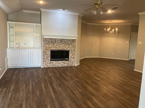 Living room with fireplace and bookcase
